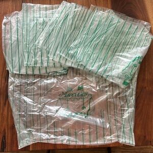 5 plastic Masters clear & green bags